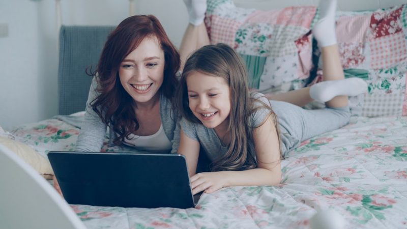 Family using a laptop together at home, safe browsing online