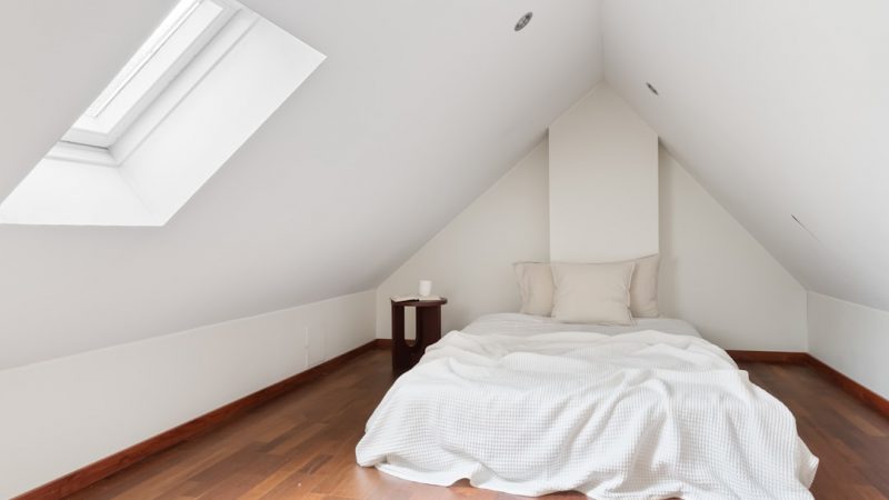 Modern loft conversion bedroom with Velux windows