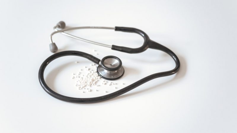 Doctor performing a health check with a stethoscope