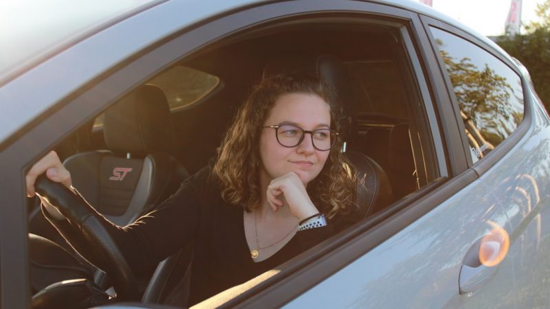 Young driver with their first car keys